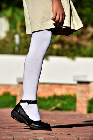 A Girl Standing Wearing White Socksの写真素材