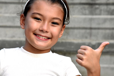 A Happy Asian Child Thumbs Upの写真素材