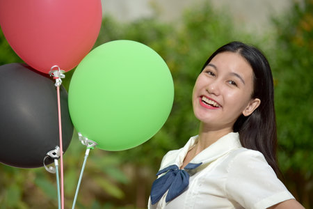Young Happy Asian Woman With Balloonsの写真素材