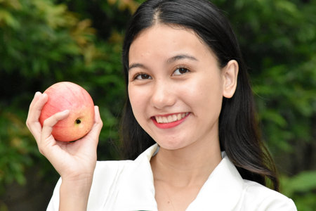 A Philippine Woman With An Appleの写真素材