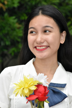 Smiling Youthful Minority Female With Bouquet Of Flowersの写真素材