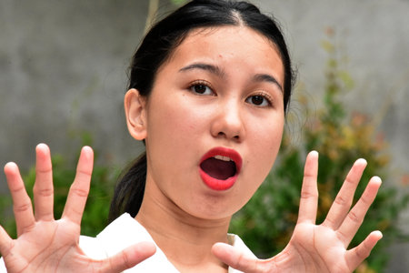 A Scared And Startled Asian Womanの写真素材