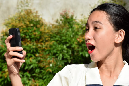 An Excited Beautiful Filipina Femaleの写真素材