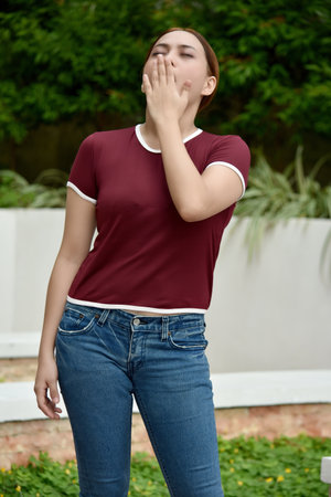 A Tired Beautiful Redhead Female Standingの写真素材