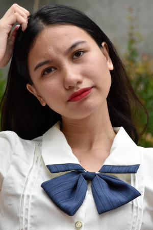 A Confused Adult Asian Femaleの写真素材