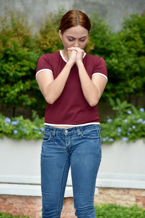 Worrisome Redhead Female Adult Wearing Tshirtの写真素材