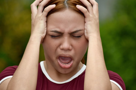Stressful Redhead Female Adult Wearing Tshirtの写真素材
