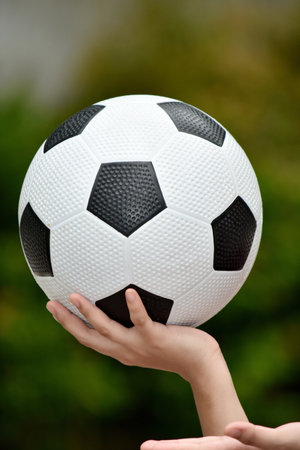 A Hand Holding Soccer Ballの写真素材
