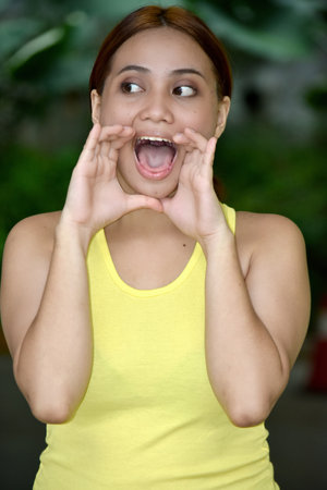 Talking Pretty Asian Female Wearing Tshirtの写真素材