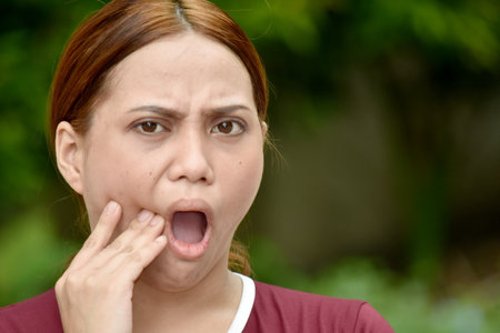 An Attractive Female With Toothacheの写真素材