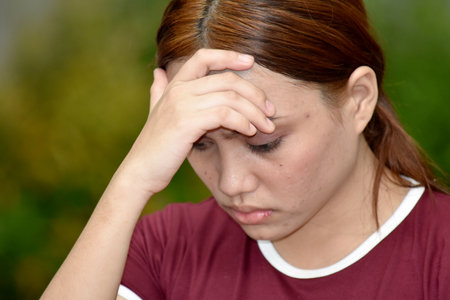 Attractive Minority Female And Sadness Wearing Tshirtの写真素材