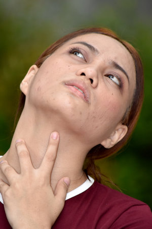 A Youthful Redhead Woman And Sorenessの写真素材