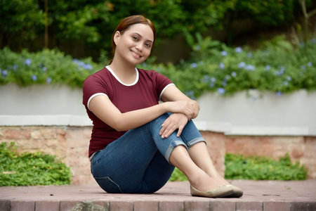 A Youthful Female And Happiness Sittingの写真素材