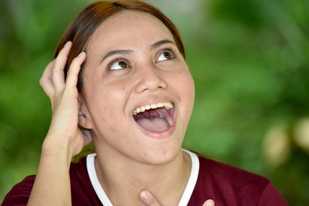 Surprised Minority Female Adult Wearing Tshirtの写真素材