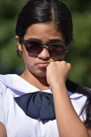 Beautiful Diverse Teen Girl And Depression With Sunglassesの写真素材