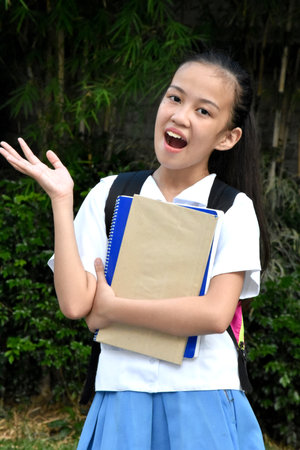 Overjoyed Student Teenager School Girl With Notebooksの写真素材