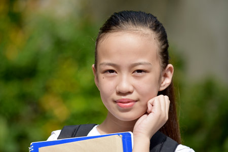 A Pretty Diverse Girl Student Waitingの写真素材