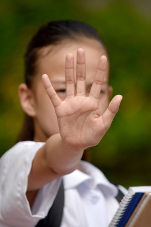 A Female Student Gesturing Stopの写真素材