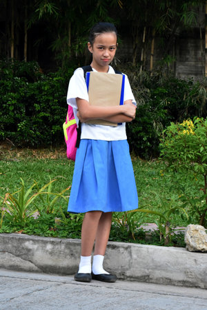 Female Student And Disappointment Wearing Bookbag Standingの写真素材