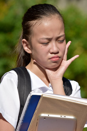 A Youthful Female Student With Toothacheの写真素材