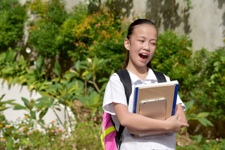 Diverse Student Teenager School Girl And Excitement With School Booksの写真素材