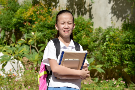 Crazy Youthful Female Student With Textbooksの写真素材