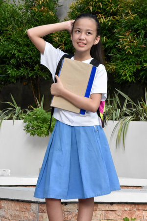 Posing Minority Girl Student With School Books Standingの写真素材