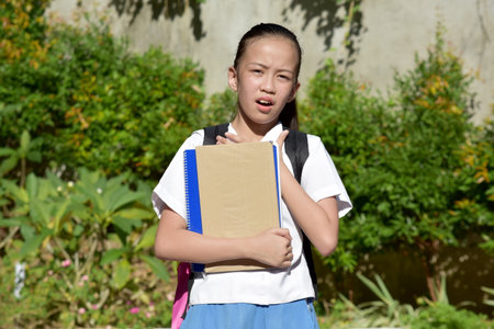 Cute Asian Girl Student And Hopelessnessの写真素材