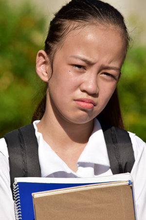 An Unhappy Cute Female Studentの写真素材
