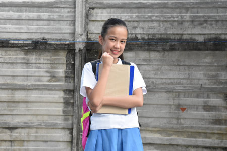 Successful Filipina Female Student Wearing Uniformの写真素材