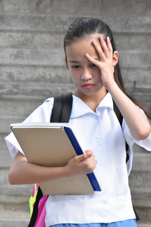 Girl Student Under Stress With Notebooksの写真素材