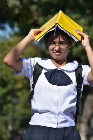 Funny Or Stupid Student Holding Booksの写真素材