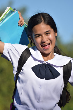 Female Student And Happiness With Textbooksの写真素材