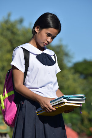 School Girl And Depression Wearing Uniform With Booksの写真素材