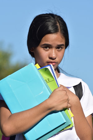 An Unhappy Beautiful Diverse Girl Studentの写真素材