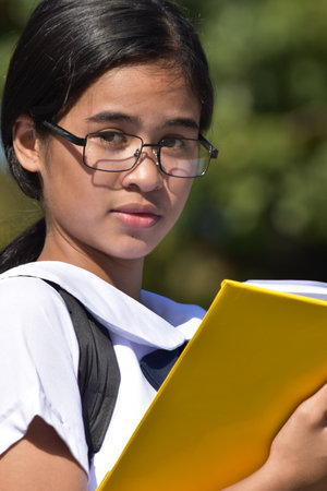 A Young Filipina Female Student Readingの写真素材