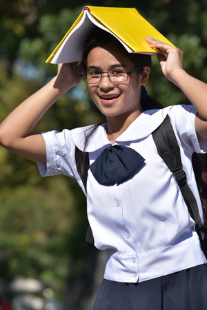 Pretty Girl Student Having Fun Wearing Glassesの写真素材