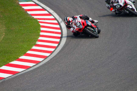 SUZUKA, JAPAN - July 29 : Rider of YOSHIMURA SUZUKI Racing Team (Not Classified) racing at 2012 Suzuka 8 hours World Endurance Championship Race, on July 29, 2012 in Suzuka Circuit, Japan.のeditorial素材