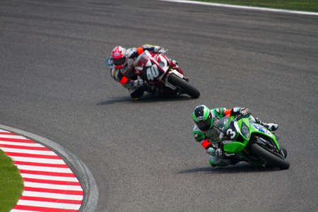 SUZUKA, JAPAN - July 29 : Rider of RS-ITOH&ASIA (13th place team) racing at 2012 Suzuka 8 hours World Endurance Championship Race, on July 29, 2012 in Suzuka Circuit, Japan.のeditorial素材