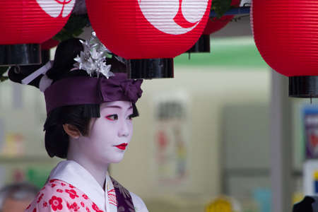 KYOTO - JULY 24: Unidentified Maiko girl (or Geiko lady) on parade of hanagasa in Gion Matsuri (Festival) held on July 24 2013 in Kyoto, Japan. It is one of Kyoto\'s renowned three great festivals. のeditorial素材