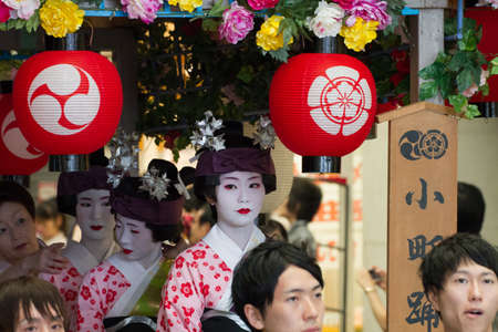 KYOTO - JULY 24: Unidentified Maiko girl (or Geiko lady) on parade of hanagasa in Gion Matsuri (Festival) held on July 24 2013 in Kyoto, Japan. It is one of Kyoto\'s renowned three great festivals. のeditorial素材