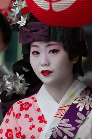 KYOTO - JULY 24: Unidentified Maiko girl (or Geiko lady) on parade of hanagasa in Gion Matsuri (Festival) held on July 24 2013 in Kyoto, Japan. It is one of Kyoto\'s renowned three great festivals. のeditorial素材