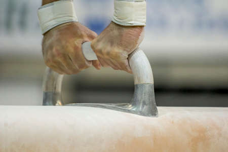 gymnast prepares hands for performance