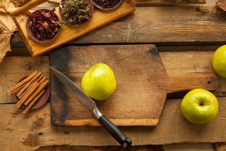 Healthy food full of vitamins and nutrition, for strong and healthy heart. Apples on wooden table prepared for cooking.の写真素材