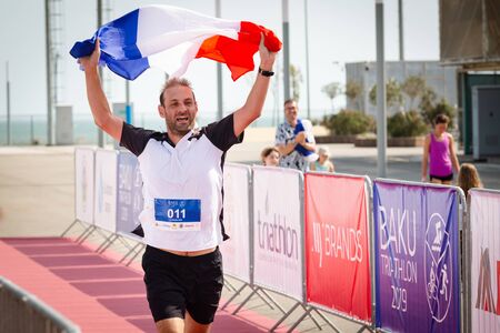 Triathlon competition in Baku. Athlet finish run.