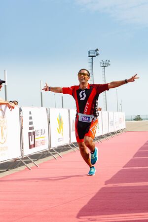 Triathlon competition in Baku. Athlet finish run.のeditorial素材