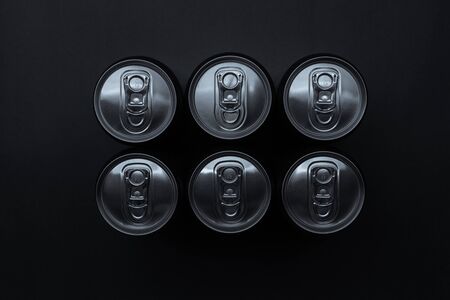 Set of aluminum cans on dark background, top view.の写真素材