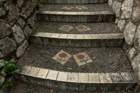 Nice, France - November 05,2020- Ancient stairs with ornament of a flower in old town of Nice. Popular travel destination in France.のeditorial素材