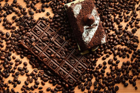 Chocolate with coffee beans and truffle cake, delicious sweet dessert for coffee or tea.