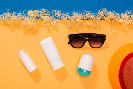 Set of sunblock moisturizer and spray to protect from sunlight on the beach. Summer vacation...